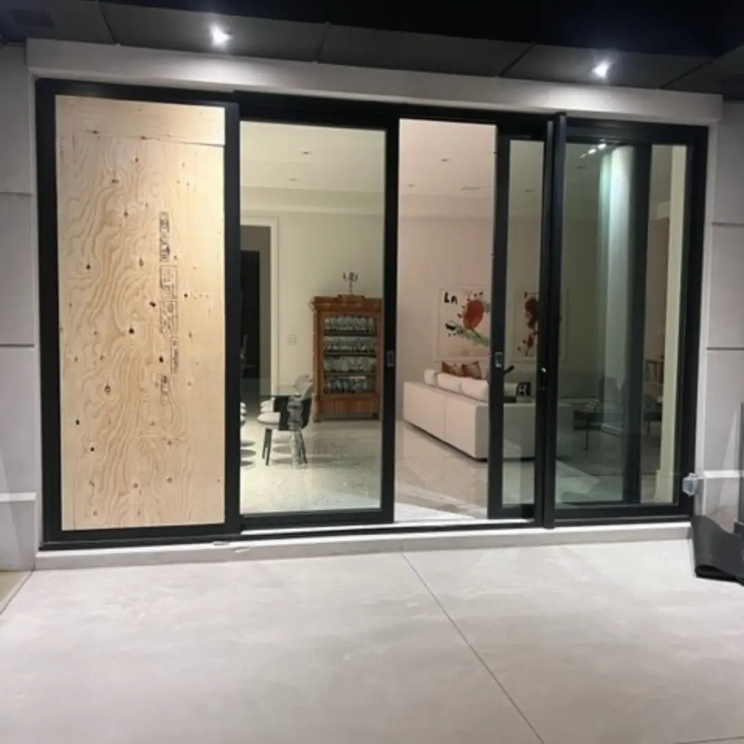 Boarded up sliding door after emergency board-up service GTA