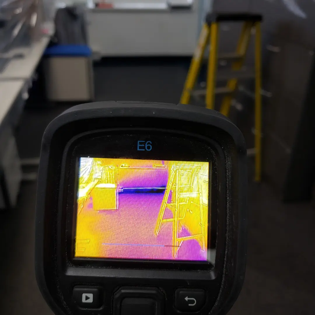 Infrared thermal camera finding hidden water damage in a Toronto home